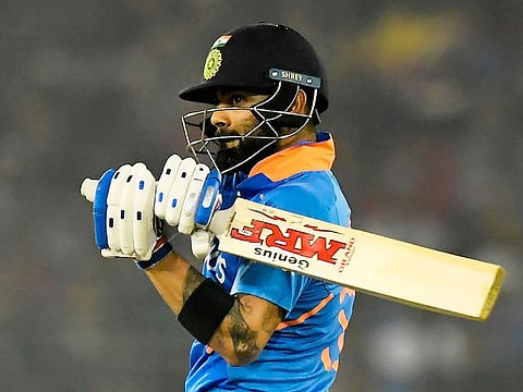 India's captain Virat Kohli plays a shot during the third one day international cricket match of a three-match series between India and West Indies at the Barabati Stadium in Cuttack on December 22, 2019.