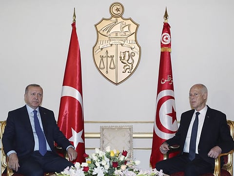 Turkey's President Recep Tayyip Erdogan, left, and Tunisian President Kais Saied pose during a meeting, in Tunis, Tunisia, Wednesday, Dec. 25, 2019.