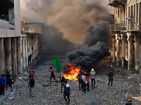 Anti-government protesters set fire while security forces close Rasheed Street during clashes in Baghdad, Iraq. As the Middle East ushers in 2020, a new kind of uprising is unfolding in the Arab world