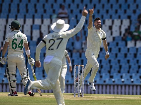 England's James Anderson (right) celebrates after dismissing South Africa's Dean Elgar off the first ball of the Test match on Thursday.
