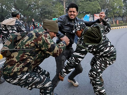 A demonstrator reacts as he is detained by police during a protest against a new citizenship law, in New Delhi, India, December 27, 2019. REUTERS/Anushree Fadnavis