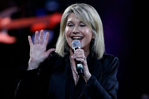 (FILES) In this file photo taken on February 23, 2017 British-Australian singer Olivia Newton-John performs at the 58th Vina del Mar International Song Festival on February 23, 2017 in Vina del Mar, Chile. British-born Australian singer Olivia Newton-John is made a Dame Commander of the Order of the British Empire (DBE) for services to charity, cancer research and entertainment in the 2020 New Years Honours list. / AFP / PAUL PLAZA