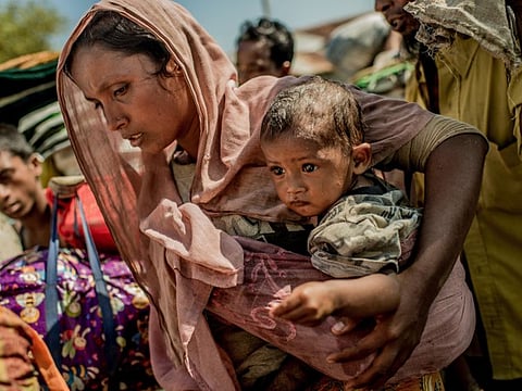 Rohingya refugees walking from the border with Myanmar near Cox's Bazaar, Bangladesh