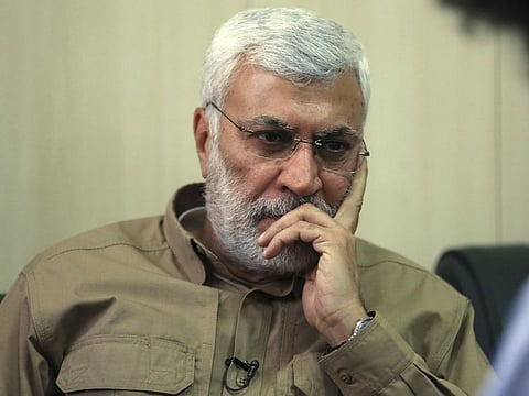 In this May 29, 2016 file photo, Abu Mahdi al-Muhandis a commander in the Popular Mobilization Forces listens to a question during an interview in Fallujah, Iraq.