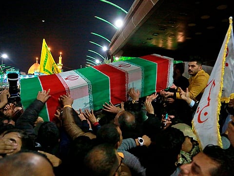 Mourners carry the coffins of Iran's top general Qassem Soleimani during their funeral in Karbala, Iraq, Saturday, Jan. 4, 2020. Iran has vowed "harsh retaliation" for the U.S. airstrike near Baghdad's airport that killed Tehran's top general and the architect of its interventions across the Middle East, as tensions soared in the wake of the targeted killing. (AP Photo/Khalid Mohammed)