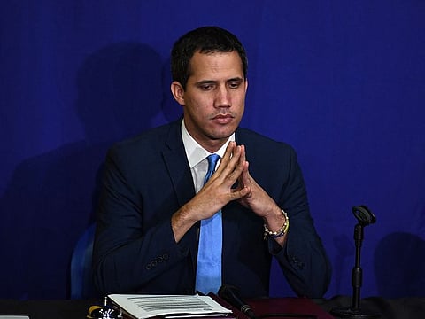 Venezuelan opposition leader and self-proclaimed acting president Juan Guaido is pictured during a parliamentary session with allied lawmakers in which he was re-elected as Venezuela’s parliament speaker, at the offices of the El Nacional newspaper in Caracas, on January 5, 2020 after being prevented from entering the National Assembly.