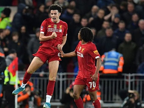Liverpool's Curtis Jones celebrates his strike against Everton in the FA Cup.