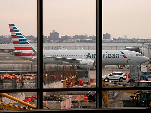 An American Airlines 737 Max sits at the gate at LaGuardia airport in New York.