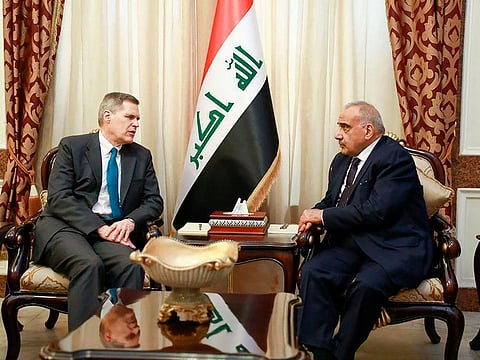 Iraqi acting Prime Minister Adil Abdul-Mahdi, right, meets with U.S. Ambassador to Iraq Matthew Tueller at the prime minister's office, in Baghdad, Iraq, Monday, Jan. 6, 2020.
