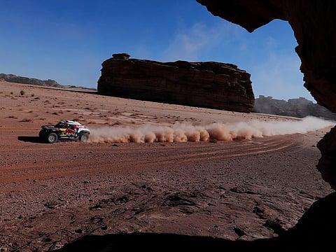 Bahrain JCW X-Raid Team's Carlos Sainz and Lucas Cruz on their way to winning the third stage of Dakar Rally on Tuesday.