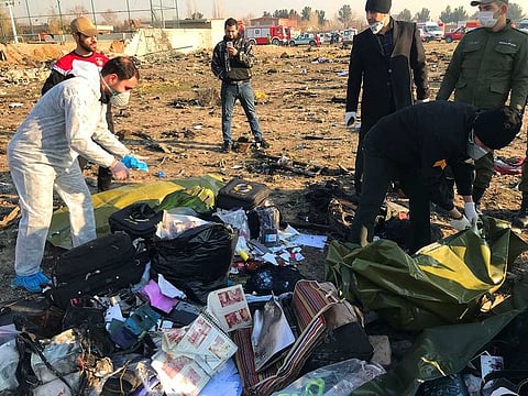 Passengers' belongings are seen after the Ukraine International Airlines plane crashed after take-off from Iran's Imam Khomeini airport