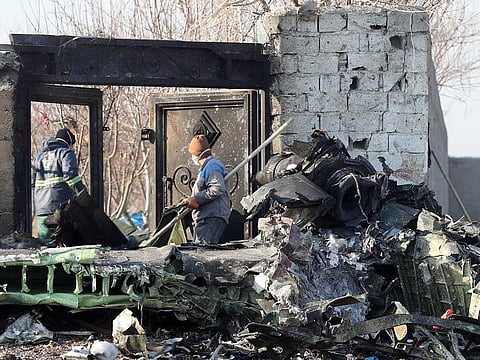Rescue teams work amidst debris after a Ukrainian plane carrying 176 passengers crashed near Imam Khomeini airport.