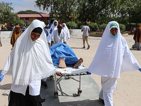 Nurses carry a wounded person on a stretcher after a blast near the Somali parliament at the Medina hospital in Mogadishu, Somalia, January 8, 2020.