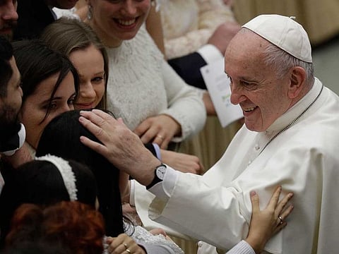 Pope Francis salutes the faithful at the end of his weekly general audience at the Vatican, Wednesday, Jan. 8, 2020.