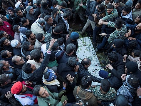 Mourners at the burial of Qasem Soleimani, who was killed in an air strike at Baghdad airport, at his hometown in Kerman, Iran