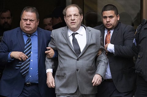 Harvey Weinstein, center, leaves court following a bail hearing, Friday, Dec. 6, 2019 in New York. (AP Photo/Mark Lennihan)