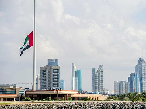 UAE Flag in half mast to mourn the death of Sultan Qaboos of Oman