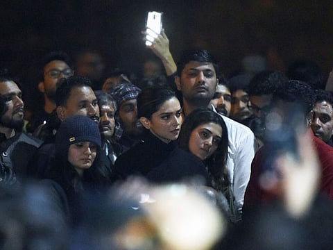 In this photo taken on January 7, 2020, Bollywood actress Deepika Padukone (C) visits students protesting at Jawaharlal Nehru University (JNU) against a recent attack at JNU on students and teachers in New Delhi.
Protests have been held across India after masked assailants wielding batons and iron rods went on a rampage at a top Delhi university, leaving more than two dozen injured. / AFP / STR