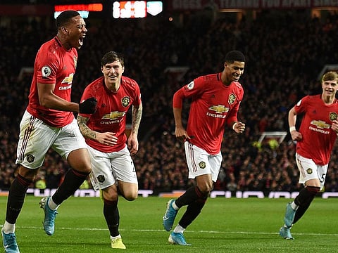 Manchester United's Anthony Martial celebrates scoring their third goal against Norwich City.
