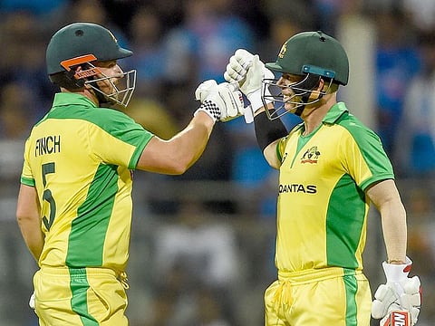 Australia's Aaron Finch (L) and teammate David Warner (R)