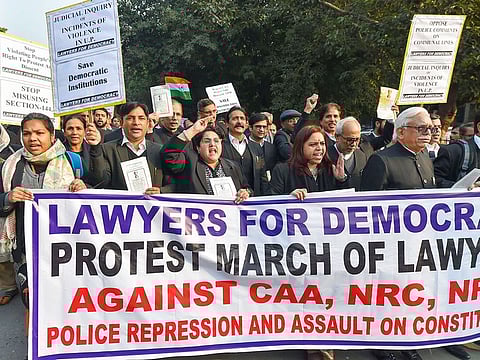 Advocates of Lawyers For Democracy stage a protest outside the Supreme Court over various issues including CAA, NRC and NPR, in New Delhi, on January 14, 2020.