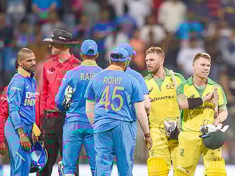 Australian batsman David Warner and Aaron Finch being congratulated by Indian players after they chased down the target to win the first ODI at the Wankhede Stadium in Mumbai, on Jan. 14, 2020.