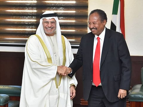 UAE Minister of State for Foreign Affairs Anwar Gargash and Sudanese Premier Abdalla Hamdok