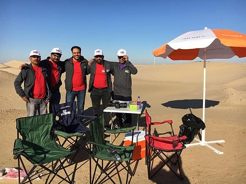Gulf News volunteers ready to receive participants of Gulf News Overnighter Fun Drive at Checkpoint 1, about 30 km away from the start point at Tilal Swaihan.Photo: Nagarjuna Rao