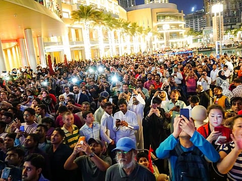 Thousands throng the Burj Khalifa to watch a special LED display on the occassion of UAE National Day
