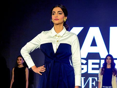 (FILES) In this file photo taken on October 18, 2019, Bollywood actress Sonam Kapoor Ahuja stands on the stage during the launch of capsule collection of Karl Lagerfeld in Mumbai. / AFP / Sujit JAISWAL