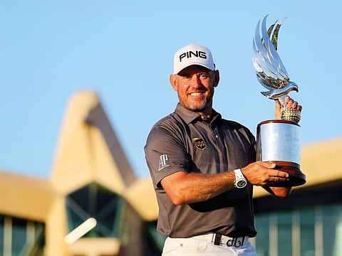 Lee Westwood holds aloft the Falcon Trophy at the Abu Dhabi Golf Course on Sunday.