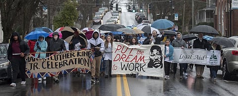 People brave the rain Saturday afternoon to take part in the 33rd annual Martin Luther King, Jr. celebration in Abingdon, Virginia.
