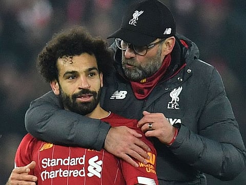 Liverpool's Jurgen Klopp embraces Mo Salah.