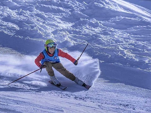 A young boy skis in the powder snow at the top of the ski resort in Malam Jabba, Pakistan, on January 18, 2020.