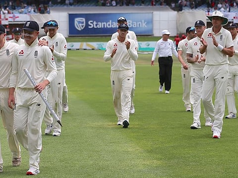 Members of the England squad look relaxed after beating South Africa by an innings on Monday.