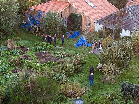 In this aerial file photo taken on October 30, 2019 Dutch judges visits the farmhouse in Ruinerwold where a family was allegedly held captive for nearly a decade as Dutch prosecutors confirmed today the three-month extension to the detention of two suspect in the case.