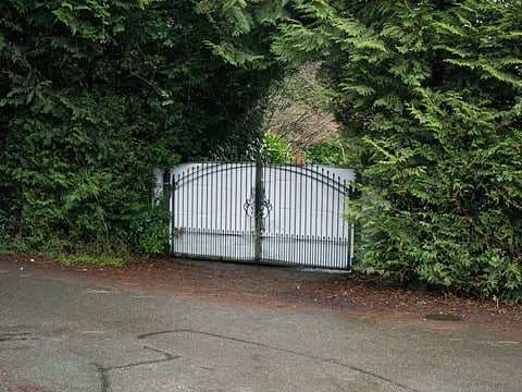 A shielded gate marks the entrance of Meghan and Harry's temporary estate in North Saanich, Municipality in Vancouver Island, British Columbia, Canada on January 20, 2020.