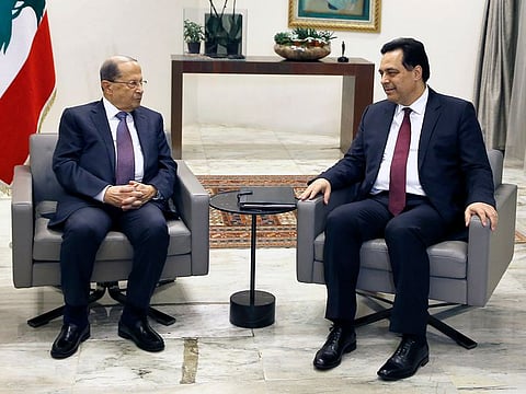 Lebanese President Michel Aoun, left, meets with Prime Minister-Designate Hassan Diab at the Presidential Palace in Baabda, east of Beirut, Lebanon, Tuesday, Jan. 21, 2020.