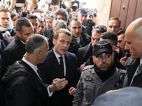 French President Emmanuel Macron asks the Israeli police to leave the 12th-century Church of Saint Anne in the old city of Jerusalem on January 22, 2020.