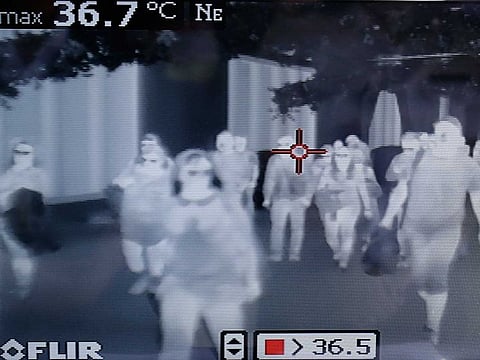 Airports worldwide have been using thermal scanner checks on passengers. Pictured here are checks happening at Manila's international airport. Picture for illustrative purposes only.