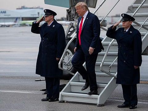President Donald Trump arrives at Miami International Airport to attend the Republican National Committee winter meetings, Thursday, Jan. 23, 2020.