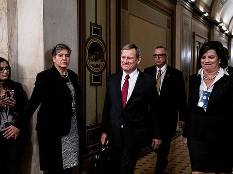 Chief Justice John Roberts, center, leaves at the conclusion of the day's Senate impeachment trial of President Donald Trump, in Washington on Friday, Jan. 24, 2020.