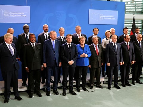Britain's Prime Minister Boris Johnson, Republic of Congo's President Denis Sassou Nguesso, Turkish President Recep Tayyip Erdogan, French President Emmanuel Macron, German Chancellor Angela Merkel, United Nations Secretary-General Antonio Guterres, Russian President Vladimir Putin, Egyptian President Abdul Fattah Al Sissi, Algerian President Abdul Madjid Tebboune, US Secretary of State Mike Pompeo and European Commission President Ursula von der Leyen pose for a photo during the Libya summit in Berlin, Germany, on January 19, 2020.