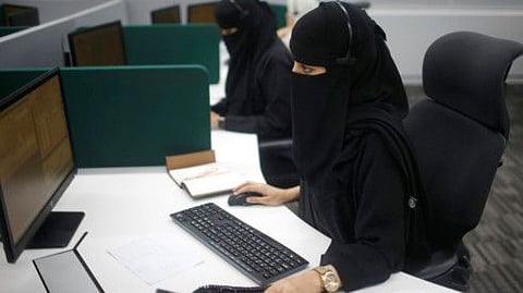 Saudi women work at the first all-woman call centre in the security sector in Makkah, Saudi Arabia.