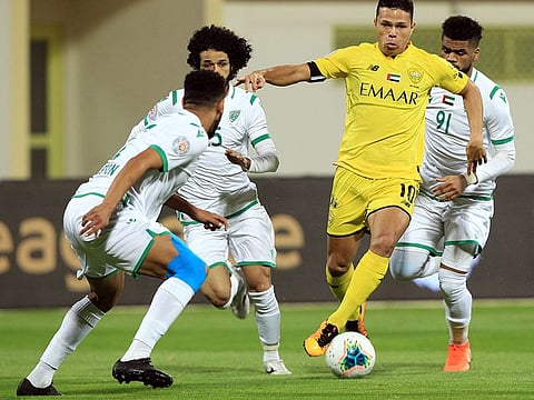 Brazilian striker Fabio De Lima of Al Wasl (yellow) wants to give it his all for the UAE once his citizenship comes through after Sebastian Tagliabue and Caio Canedo.