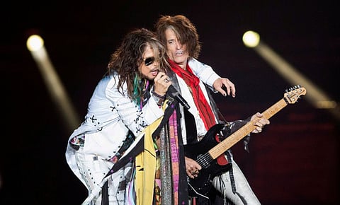 Vocalist Steven Tyler (L) and guitarist Joe Perry of Aerosmith perform during their "Aerosmith: Let Rock Rule" tour at The Forum in Inglewood, California July 30, 2014.