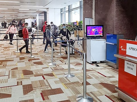 A thermal screening device checks passengers arriving in India from China in view of the coronavirus outbreak, at Delhi International airport.