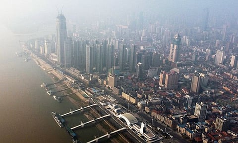 An aerial view shows residential and commercial buildings of Wuhan in China's central Hubei province on January 27, 2020, amid a deadly virus outbreak in the city.