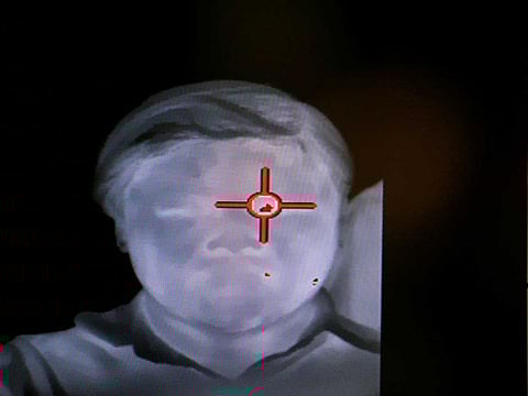 An official uses a thermal camera at the arrivals hall of Suvarnabhumi Airport as a measure to prevent the spread of coronavirus in Bangkok, Thailand.