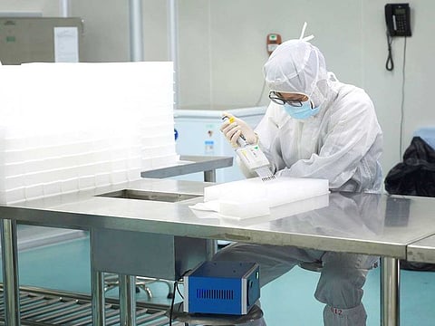 A technician works in a laboratory for manufacturing testing kits for the new coronavirus at a medical laboratory company Da An Gene Co, as the country is hit by an outbreak of the new coronavirus, in Guangzhou
